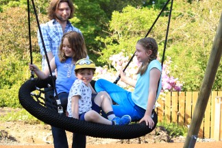 Children playing on the swing at Glendoick Playpark